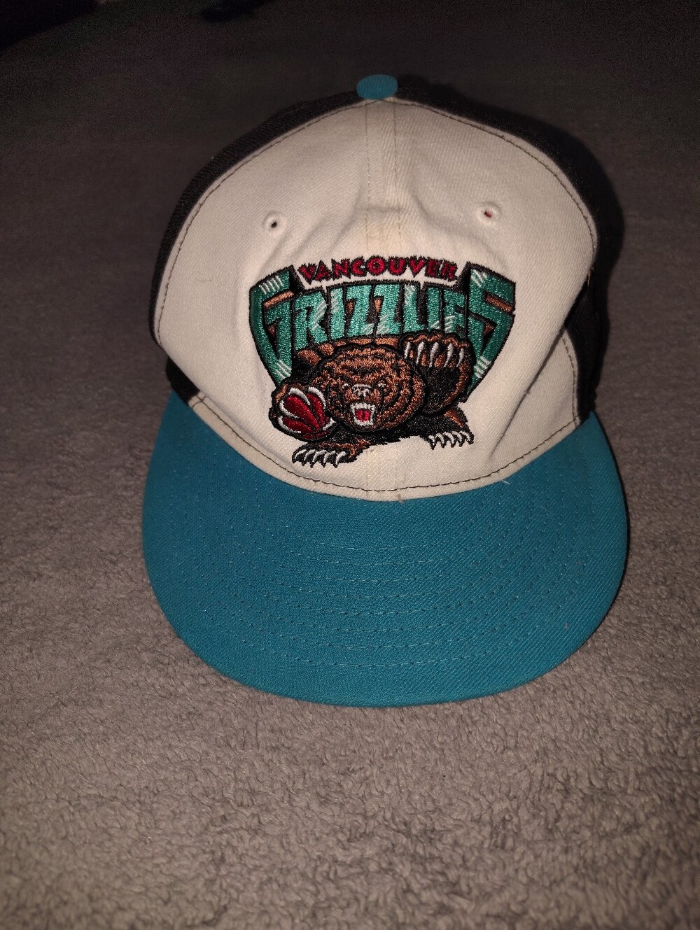 New Era Black Snapback Hat with Green Undervisor and Teal Embroidery